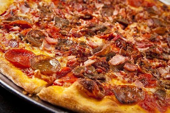 Big Ben signature pizza loaded with pepperoni, sausage, and bacon