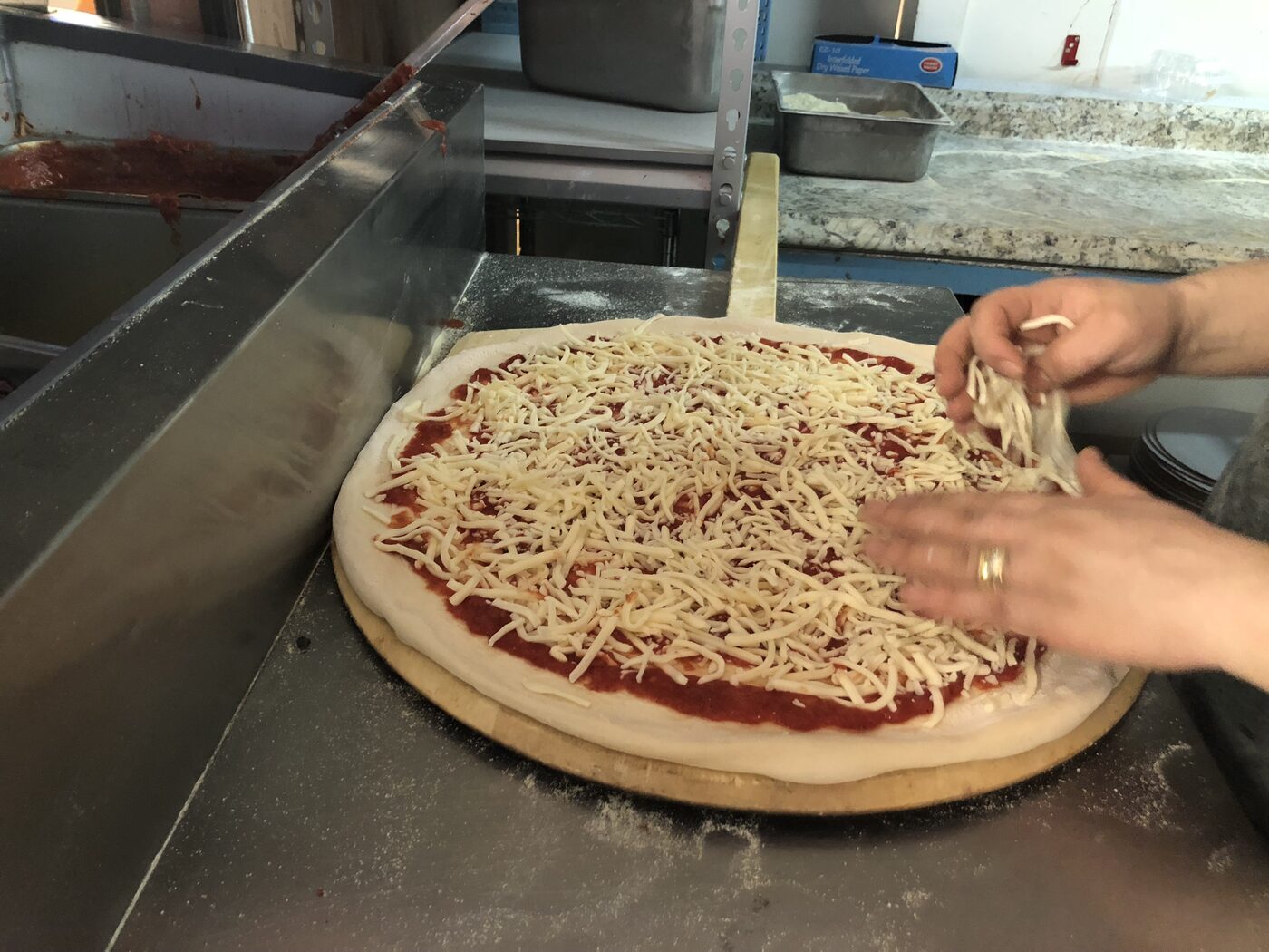 Handcrafted pizza being made fresh in the Big Ben Pizzeria kitchen